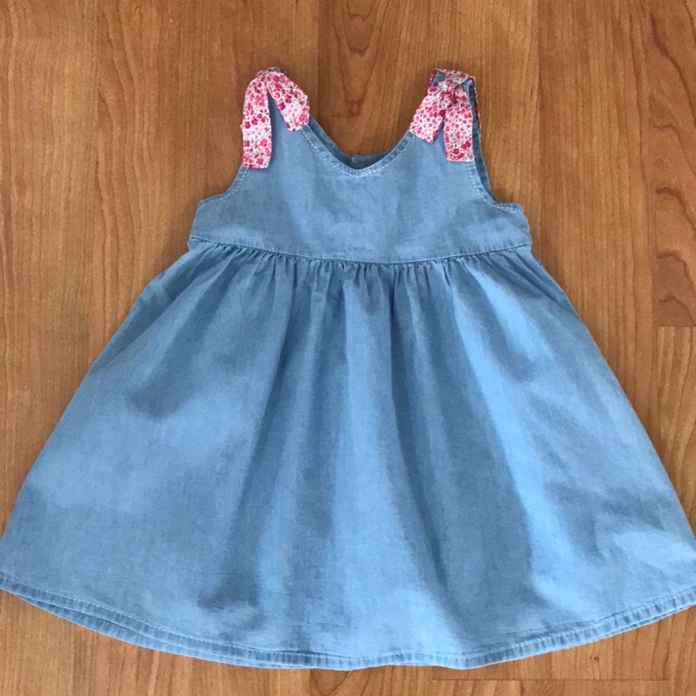 Denim dress with pink bows on the shoulders